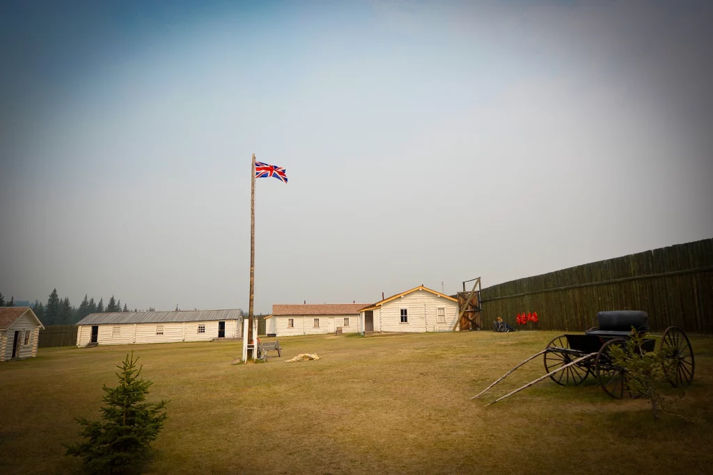 Historic Fort Walsh with Union Jack flag and wooden buildings in the Cypress Hills of Saskatchewan.
