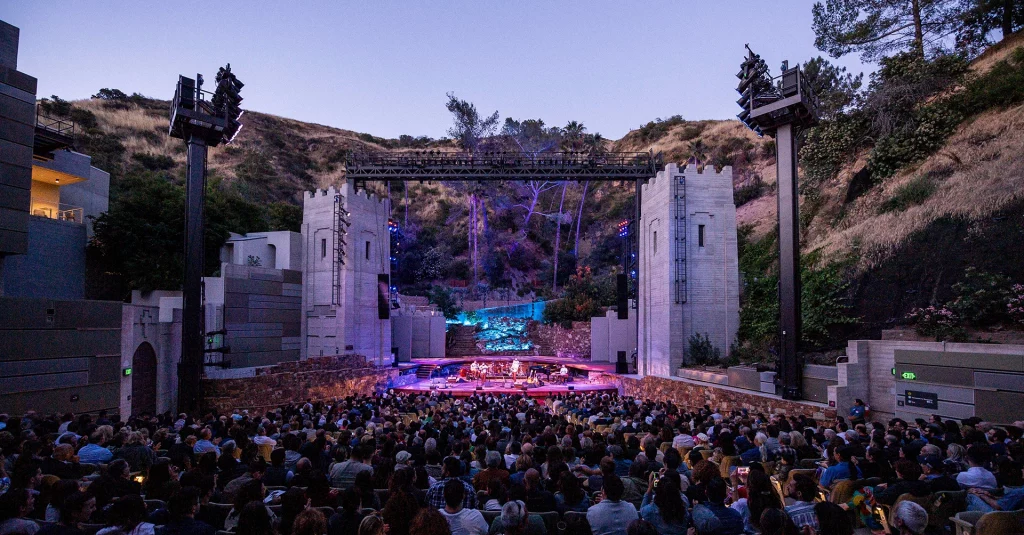 Outdoor stage and audience seating at The Ford theatre in Los Angeles during an evening performance.