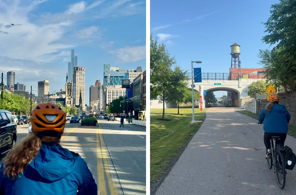 Radfahrer mit Helm fährt durch Downtown Detroit und auf einem Radweg mit Wasserturm.