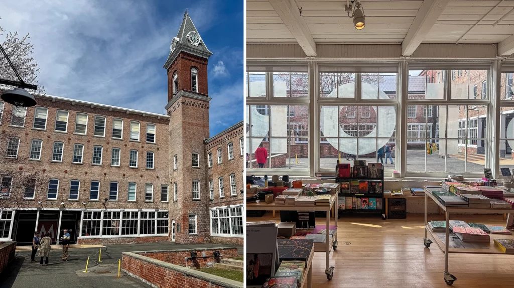 Eingangsbereich und Museumsshop des MASS MoCA in North Adams, Massachusetts, mit Blick auf das historische Fabrikgelände durch große Fenster.