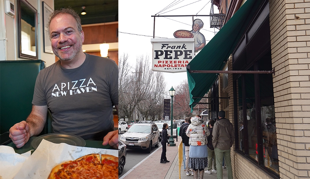 Ein Guide der New Haven Pizza Tour zeigt in der legendären Frank Pepe Pizzeria eine frisch gebackene Apizza; draußen warten Gäste in der Schlange.